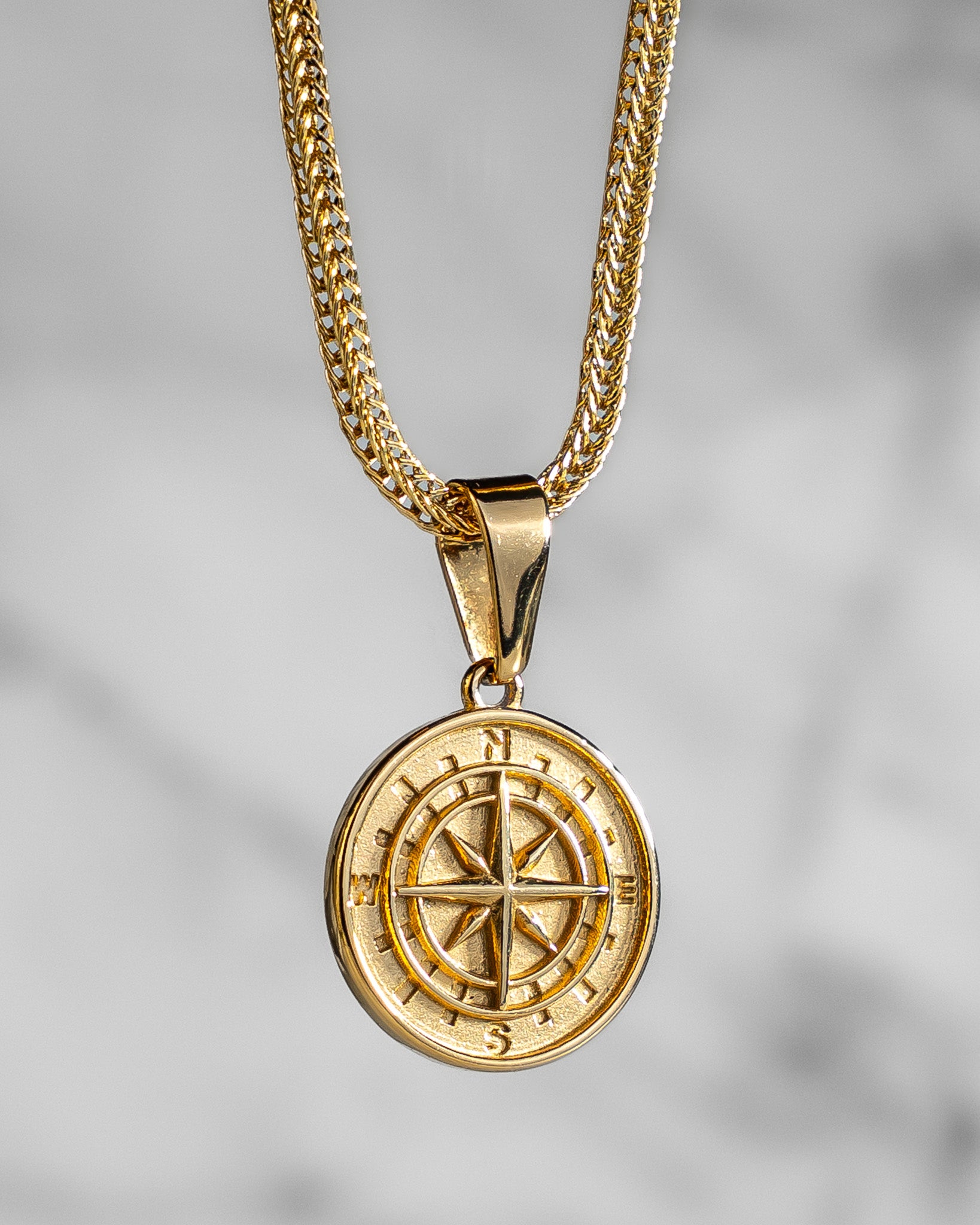 Gold compass
